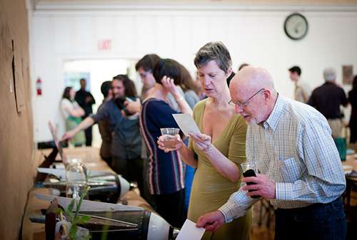 Guests check out the displays and talk with presenting artists.