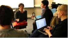 Science Trak's Norma Straw consults with Comm Lead students Katya Yefimova, Sarah McCaffrey & John Hellriegel