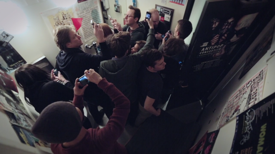 A tour group sees the bathroom where many musicians have peed in KEXP's "Tour Guide" bumper