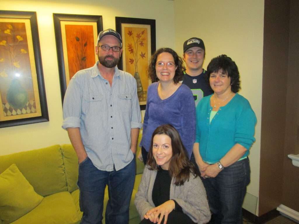 Actor/Producer/Teacher Tony Doupe with Director of Finance & Operations Julie Daman, Production Services Coordinator Krys Karns, Accounting Assistant Ken Hagen, and Administrative Assistant Cris Walters.