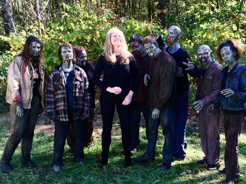 Wendy (Becker) Poischbeg, Cultural and Economic Development Manager, Snohomish County Executive’s Office, with zombies on the set of Z Nation.